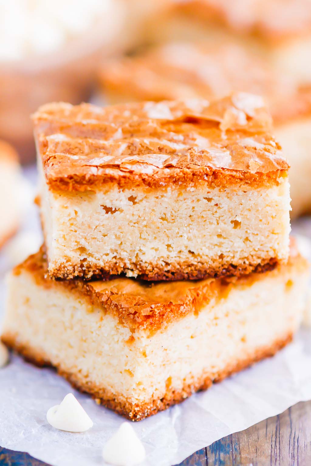 This White Chocolate Blondies Recipe combines the elegance of white chocolate with rich vanilla to bring you a delightfully sweet treat that is ready for the oven in minutes and baked in just half an hour.  Serve this recipe with a hot cup of coffee for the perfect treat on a cold day! #blondies #whitechocolate #whitechocolateblondies #blondierecipe #whitechocolatedessert #dessert #easydessert