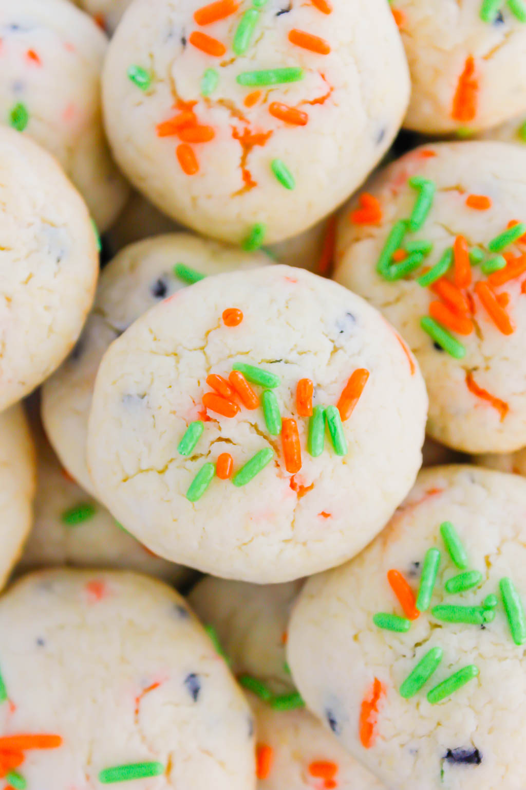 These Halloween Cookies are soft, fluffy, and made with just 4 ingredients. The sprinkles lend some Halloween fun and using cake mix makes it so easy. It's a simple recipe for a spooky night! #halloween #cookies #easy #homemade #spooky #simple #recipe #halloweenrecipes #cakemixcookies #cookierecipes