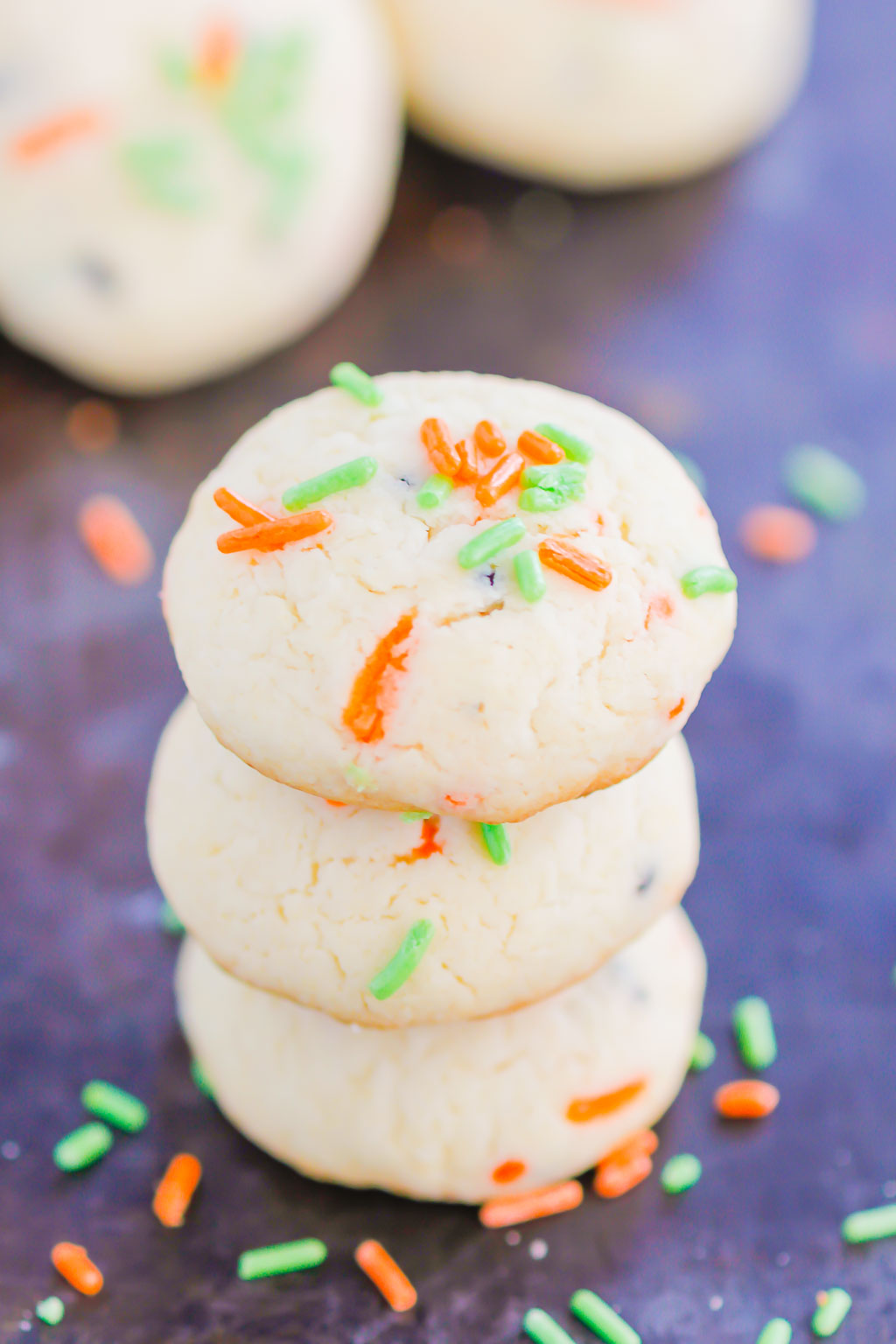 These Halloween Cookies are soft, fluffy, and made with just 4 ingredients. The sprinkles lend some Halloween fun and using cake mix makes it so easy. It's a simple recipe for a spooky night! #halloween #cookies #easy #homemade #spooky #simple #recipe #halloweenrecipes #cakemixcookies #cookierecipes