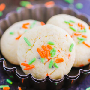 These Halloween Cookies are soft, fluffy, and made with just 4 ingredients. The sprinkles lend some Halloween fun and using cake mix makes it so easy. It's a simple recipe for a spooky night! #halloween #cookies #easy #homemade #spooky #simple #recipe #halloweenrecipes #cakemixcookies #cookierecipes