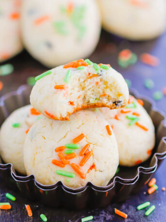 These Halloween Cookies are soft, fluffy, and made with just 4 ingredients. The sprinkles lend some Halloween fun and using cake mix makes it so easy. It's a simple recipe for a spooky night! #halloween #cookies #easy #homemade #spooky #simple #recipe #halloweenrecipes #cakemixcookies #cookierecipes