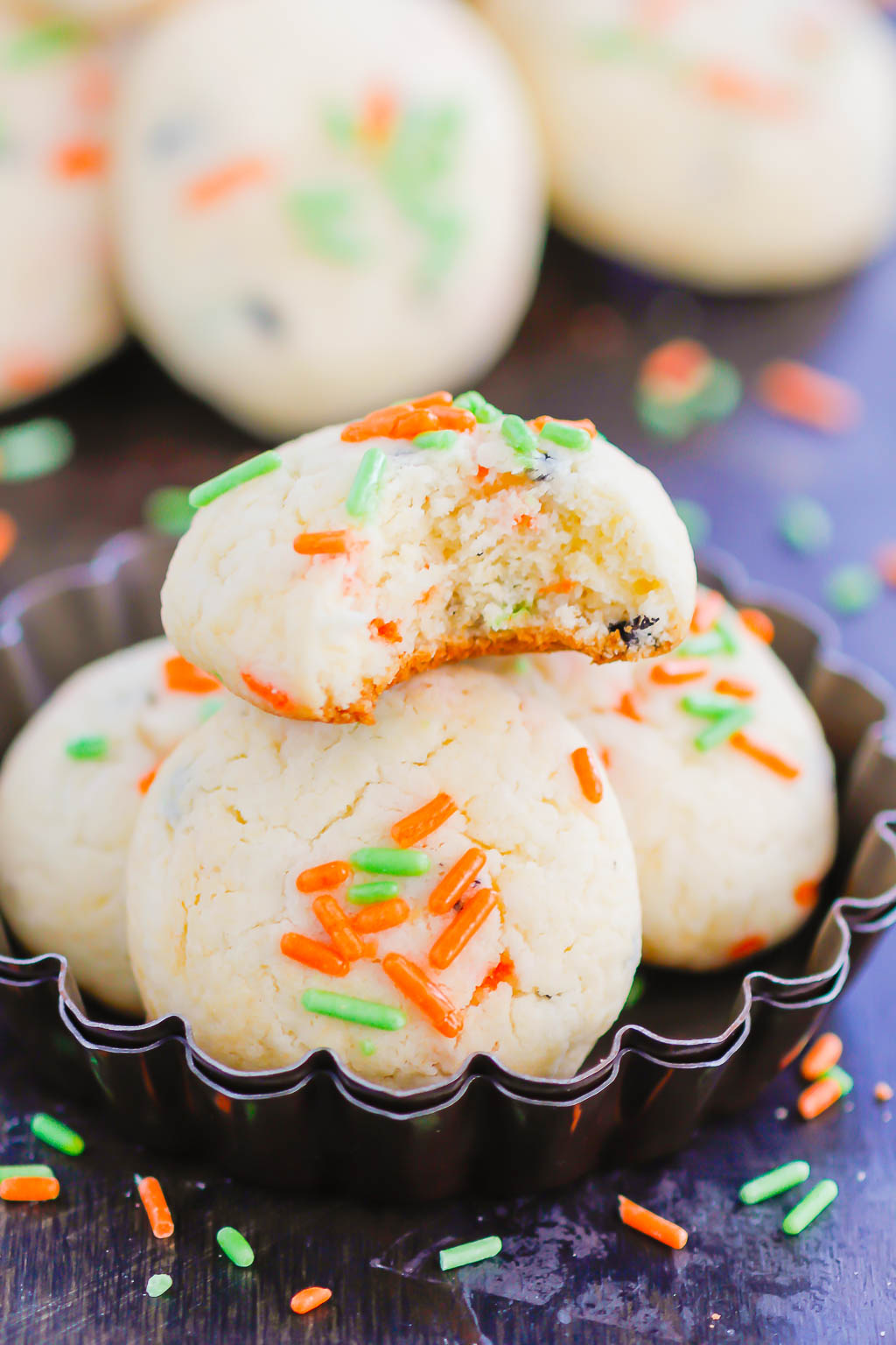 These Halloween Cookies are soft, fluffy, and made with just 4 ingredients. The sprinkles lend some Halloween fun and using cake mix makes it so easy. It's a simple recipe for a spooky night! #halloween #cookies #easy #homemade #spooky #simple #recipe #halloweenrecipes #cakemixcookies #cookierecipes