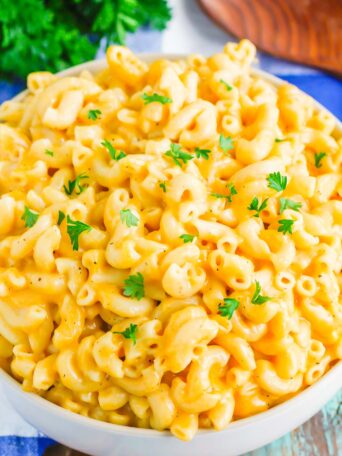 Instant Pot Creamy Macaroni and Cheese is hearty, comforting, and ready in less than 20 minutes. Made with just a few ingredients and ready in no time, it's creamy, cheesy, and so easy to make! #macaroniandcheese #macncheese #instantpotrecipes #instantpotmacaroniandcheese #instantpotmacandcheese #instantpotmacncheese #sidedish #creamymacandcheese #thanksgiving #dinner