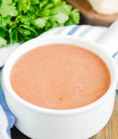 Instant Pot Tomato Basil Soup is an easy recipe that's ready in just 30 minutes. Made entirely in a pressure cooker and with just a few ingredients, this hearty soup is creamy and bursting with flavor. It's perfect to serve when you want a quick and easy comfort dish! #soup #tomatosoup #tomatosouprecipe #instantpotrecipe #instantpotsoup #instantpottomatosoup #creamytomatosoup #tomatobasilsoup #souprecipe #dinnerrecipe #easysouprecipe