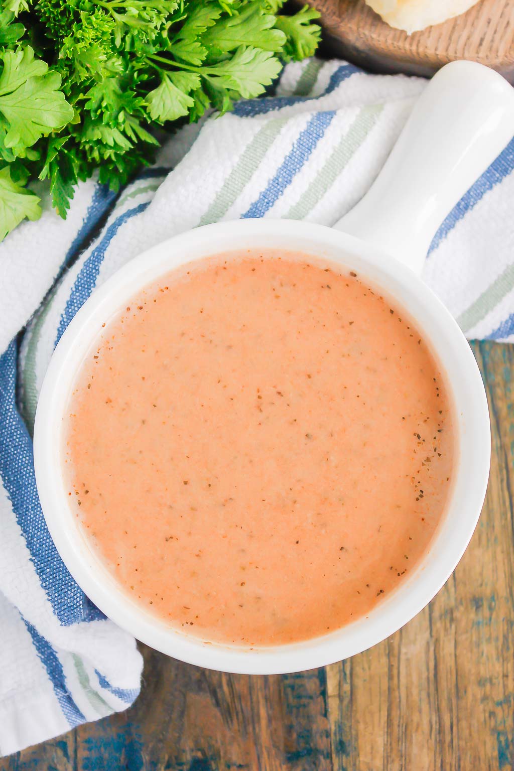 Instant Pot Tomato Basil Soup is an easy recipe that's ready in just 30 minutes. Made entirely in a pressure cooker and with just a few ingredients, this hearty soup is creamy and bursting with flavor. It's perfect to serve when you want a quick and easy comfort dish! #soup #tomatosoup #tomatosouprecipe #instantpotrecipe #instantpotsoup #instantpottomatosoup #creamytomatosoup #tomatobasilsoup #souprecipe #dinnerrecipe #easysouprecipe