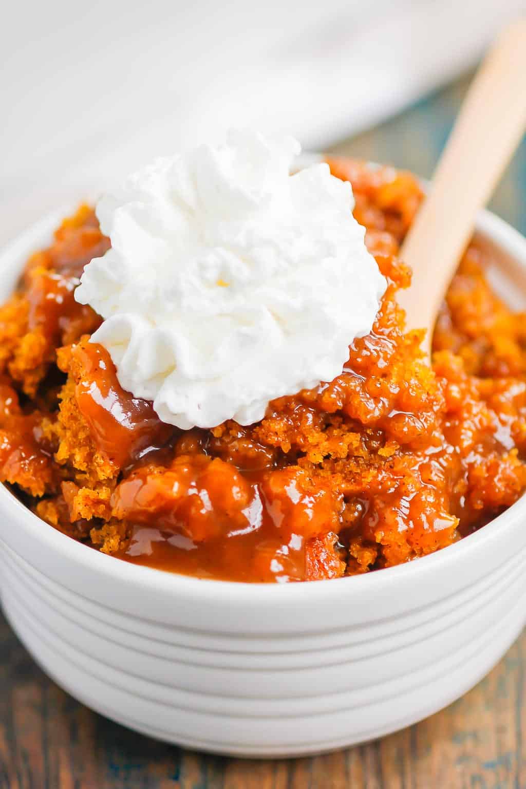 Pumpkin Cobbler is a simple dessert that's bursting with cozy flavors. With a soft, pumpkin cake on top and a decadent, caramel sauce on the bottom, this dish is perfect for fall! #cobbler #pumpkincobbler #cobblerrecipe #pumpkindessert #thanksgivingdessert #falldessert