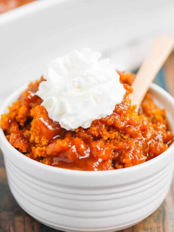 Pumpkin Cobbler is a simple dessert that's bursting with cozy flavors. With a soft, pumpkin cake on top and a decadent, caramel sauce on the bottom, this dish is perfect for fall! #cobbler #pumpkincobbler #cobblerrecipe #pumpkindessert #thanksgivingdessert #falldessert