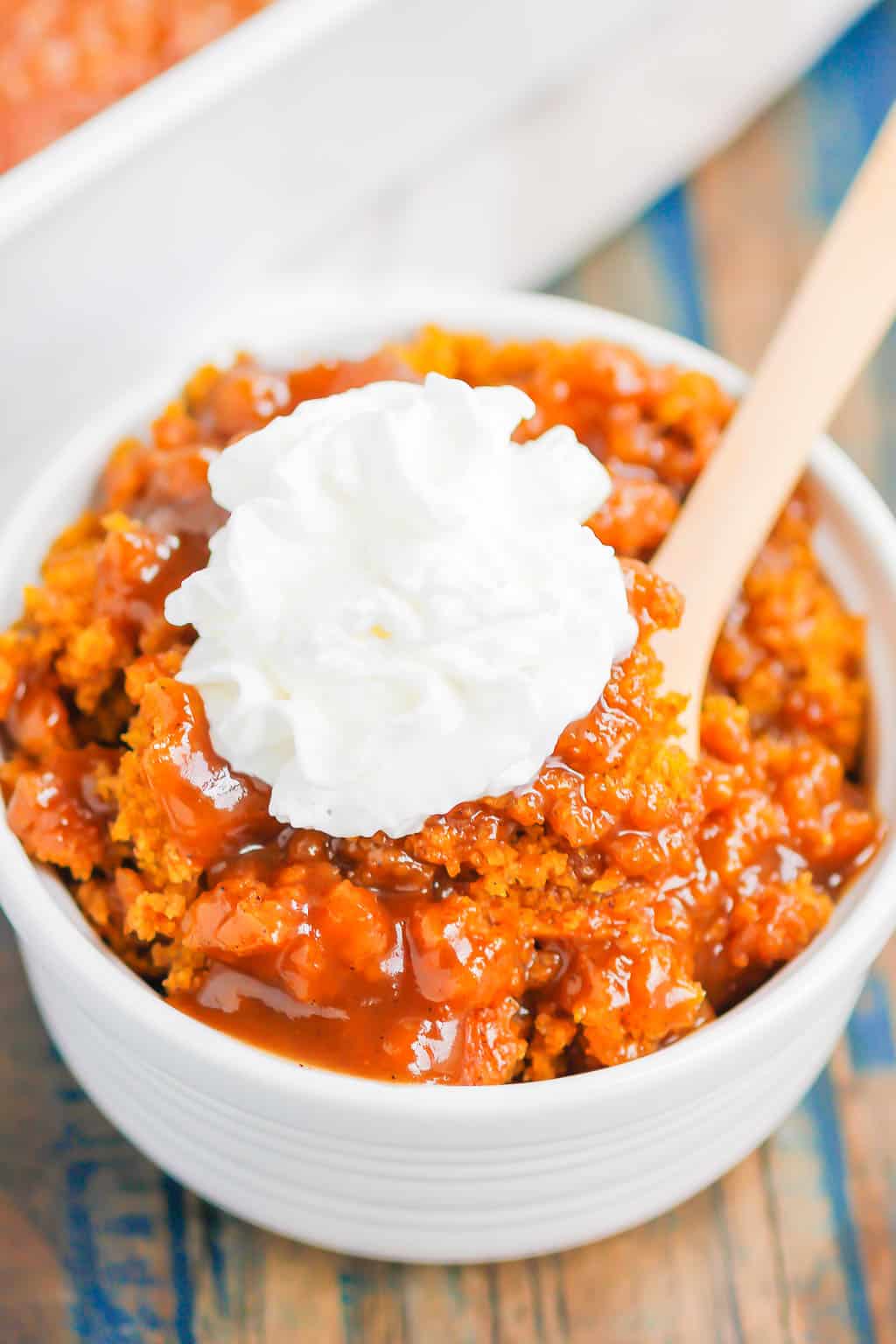 Pumpkin Cobbler is a simple dessert that's bursting with cozy flavors. With a soft, pumpkin cake on top and a decadent, caramel sauce on the bottom, this dish is perfect for fall! #cobbler #pumpkincobbler #cobblerrecipe #pumpkindessert #thanksgivingdessert #falldessert