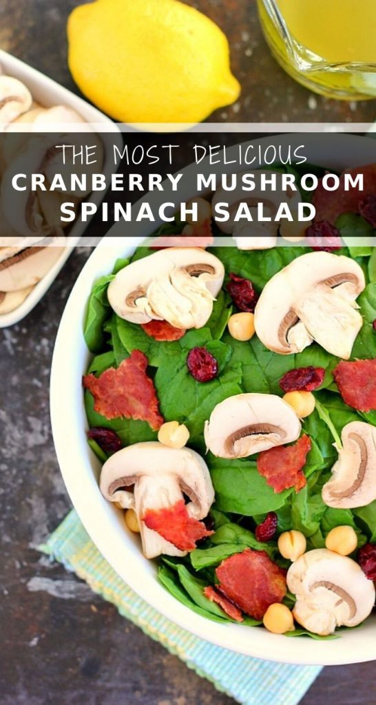 This Cranberry Mushroom Spinach Salad with Lemon Basil Vinaigrette combines baby spinach leaves, dried cranberries, fresh mushrooms, chickpeas, and crumbled bacon, all tossed with a lemon basil dressing. This dish is easy to throw together and serves as the perfect lunch or dinner! #spinachsalad #cranberries #mushroom #mushroomsalad #cranberrysalad #saladrecipes #healthysalad #thanksgiving #lunch