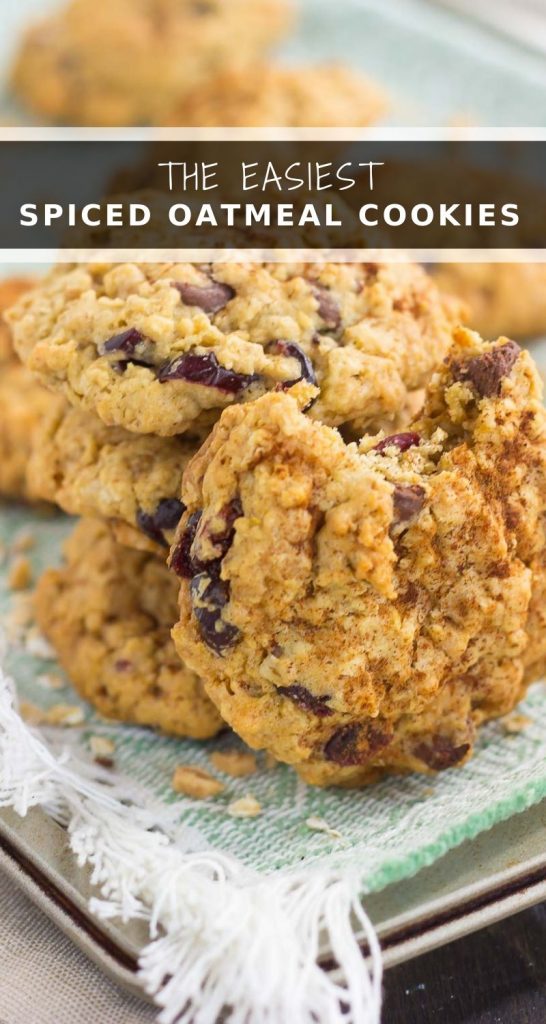 These Spiced Oatmeal Cookies are packed with hearty oats, warm spices, dried cranberries, chocolate chips, and toffee bits. Soft, chewy, and bursting with fall flavors, these cookies are perfect to enjoy all year long! #cookies #oatmealcookies #cookierecipe #oatmealcookierecipe #fallcookie #falldessert #recipe