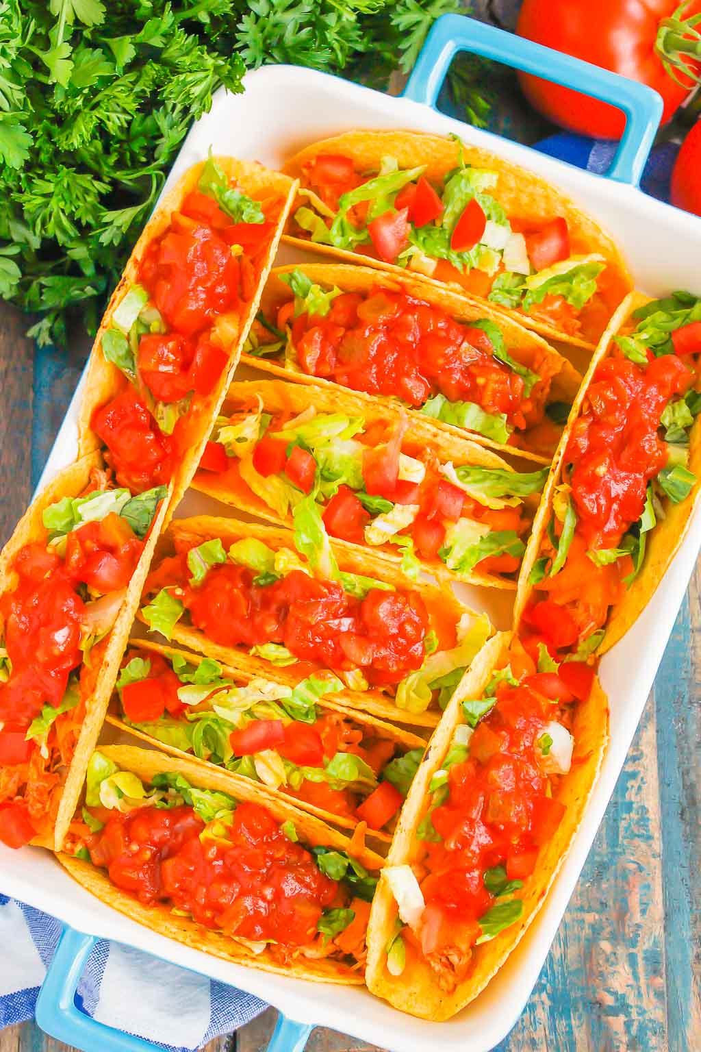 Overhead view of a baking dish of baked chicken tacos 