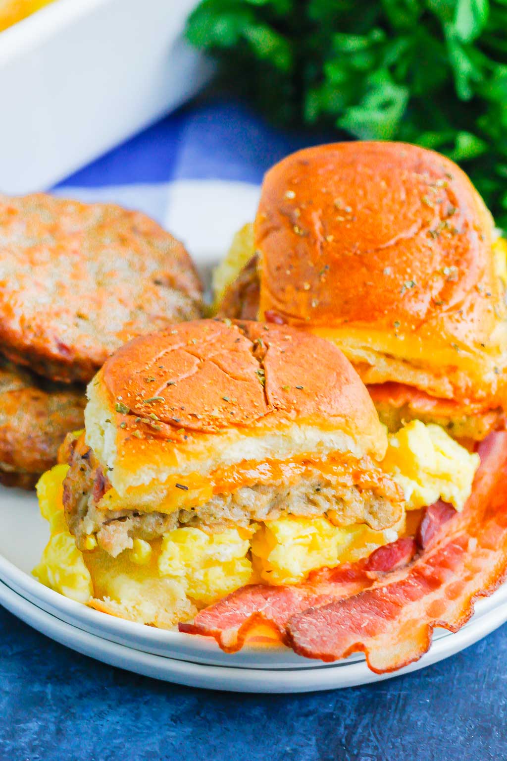 Breakfast Sliders are an easy, make-ahead dish that's filled with your favorite ingredients. Perfect to serve for a crowd or for when you need breakfast on-the-go! #sliders #breakfastsliders #breakfastsandwich #easybreakfast #makeaheadbreakfast #mealprep #breakfast