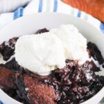 Chocolate Cobbler is a deliciously decadent dessert that's ready in no time. With a brownie like topping and a rich, fudgy sauce on the bottom, this dish tastes like molten lava cake, but in cobbler form! #cobbler #chocolate #chocolatecobbler #chocolatedessert #lavacake #dessert