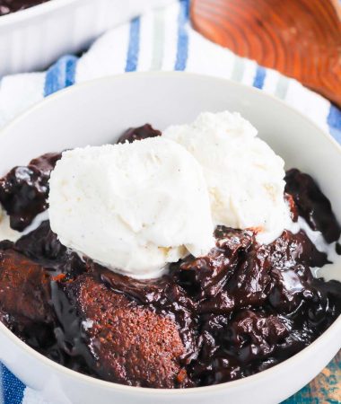 Chocolate Cobbler is a deliciously decadent dessert that's ready in no time. With a brownie like topping and a rich, fudgy sauce on the bottom, this dish tastes like molten lava cake, but in cobbler form! #cobbler #chocolate #chocolatecobbler #chocolatedessert #lavacake #dessert