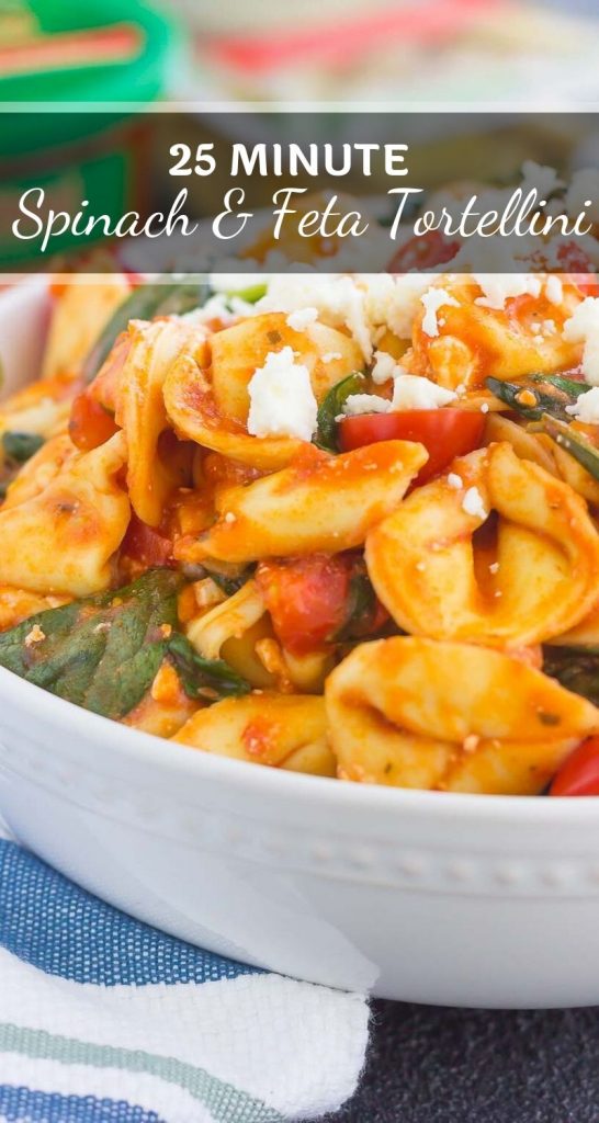 This Spinach and Feta Tortellini is fresh, flavorful, and ready in less than 30 minutes. Cheese tortellini is tossed in a zesty marinara sauce and sprinkled with fresh spinach and crumbled feta cheese. Easy to make and perfect for busy weeknights, this warm and comforting pasta will fill you up and keep you coming back for more! #tortellini #spinach #spinachtortellini #feta #spinachpasta #pasta #dinner #easydinner