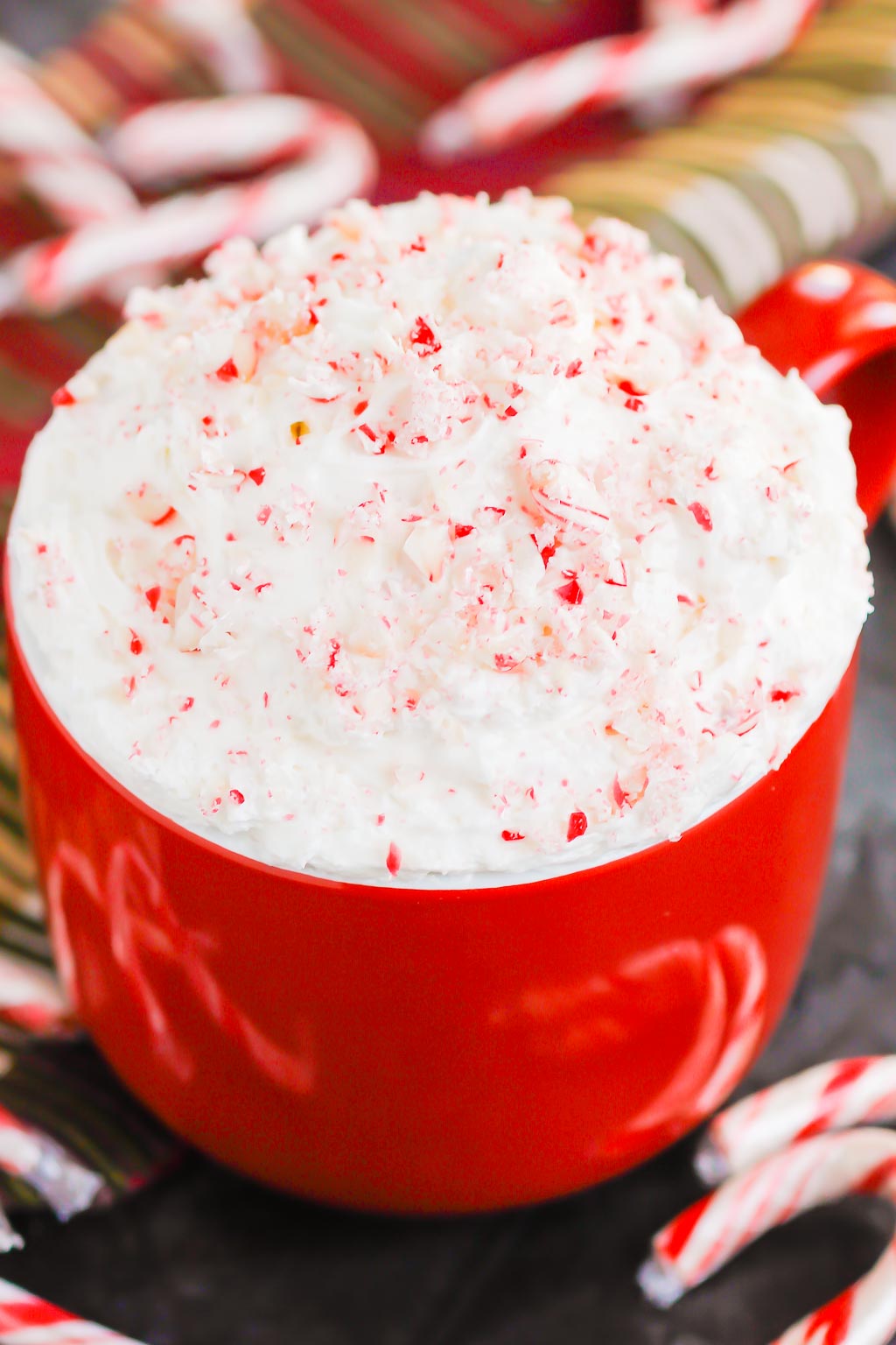 You're going to fall in love with how easy and delicious this Peppermint Cheesecake Dip recipe is to make. Itâ€™s a bright and refreshing dessert option for your holiday table. This treat mixes up in minutes and will be a hit with everyone! #peppermint #peppermintdip #peppermintcheesecake #peppermintcheesecakedip #candycanedip #dessert #christmasdessert #holidaydessert