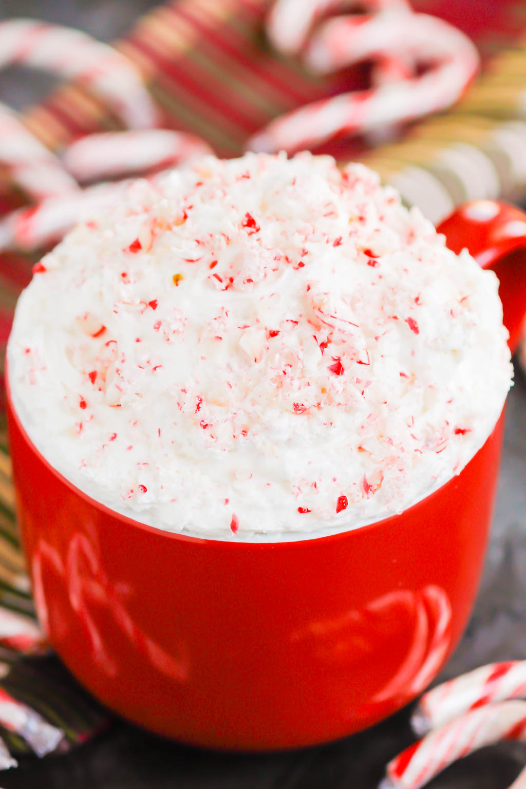 You're going to fall in love with how easy and delicious this Peppermint Cheesecake Dip recipe is to make. Itâ€™s a bright and refreshing dessert option for your holiday table. This treat mixes up in minutes and will be a hit with everyone! #peppermint #peppermintdip #peppermintcheesecake #peppermintcheesecakedip #candycanedip #dessert #christmasdessert #holidaydessert