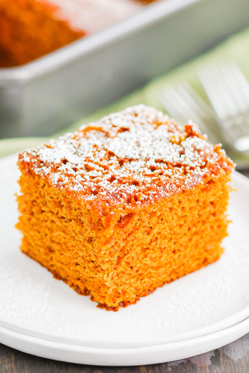 a slice of christmas gingerbread cake on a white plate. 