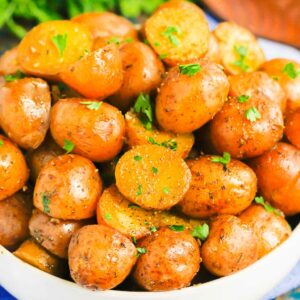 Instant Pot Garlic Herb Potatoes are tender, flavorful, and ready in just 20 minutes. Made with just a few simple ingredients, these potatoes are sure to be a delicious side dish for just about any meal! #potatoes #babypotatoes #instantpot #instantpotpotatoes #sidedish #thanksgivingsidedish