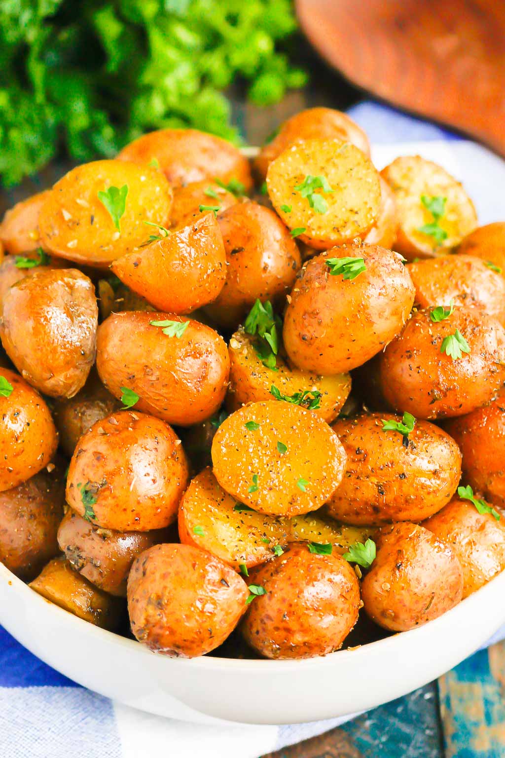 instant pot baby potatoes in a large white serving bowl 
