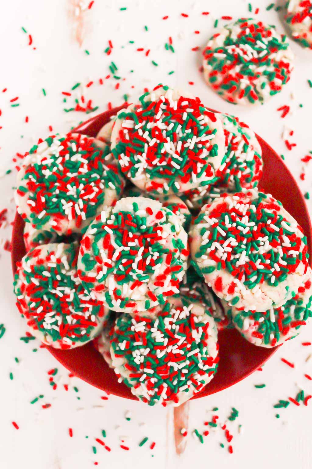 overhead view of a plate of sprinkle cookies. 