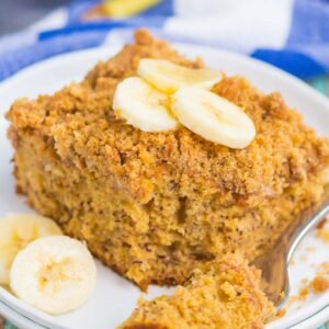 Banana Coffee Cake makes the most delicious breakfast or dessert. Sweet bananas are packed into a soft and fluffy cake and studded with a crispy cinnamon streusel topping. It's easy to make and perfect for just about any time! #cake #coffeecake #coffeecakerecipe #bananacoffeecake #bananacake #bananacrumbcake #bananadessert #bananabreakfast #bananarecipe #breakfast #dessert
