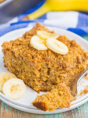 Banana Coffee Cake makes the most delicious breakfast or dessert. Sweet bananas are packed into a soft and fluffy cake and studded with a crispy cinnamon streusel topping. It's easy to make and perfect for just about any time! #cake #coffeecake #coffeecakerecipe #bananacoffeecake #bananacake #bananacrumbcake #bananadessert #bananabreakfast #bananarecipe #breakfast #dessert