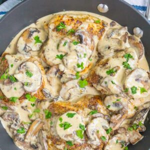 Creamy Parmesan Mushroom Chicken is an easy, one pan dish that's ready in just 30 minutes. Tender chicken and sautéd mushrooms are tossed in a simple parmesan cream sauce. It's fast, flavorful, and guaranteed to be a dinnertime favorite! 