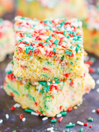Holiday Cake Mix Bars make a simple, one bowl treat that's ready in no time. With just a few ingredients, these bars bake up soft, chewy, and all-around delicious! #cake #cakebars #cakerecipe #cakebarrecipe #easycakerecipe #holidaycake #holidaydessert #christmascake #christmasdessert #dessert