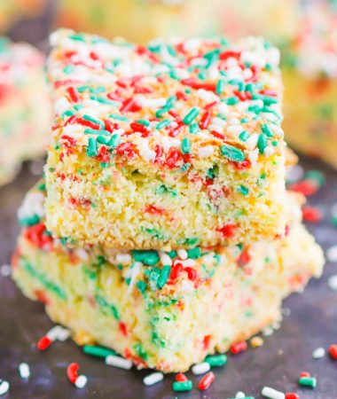Holiday Cake Mix Bars make a simple, one bowl treat that's ready in no time. With just a few ingredients, these bars bake up soft, chewy, and all-around delicious! #cake #cakebars #cakerecipe #cakebarrecipe #easycakerecipe #holidaycake #holidaydessert #christmascake #christmasdessert #dessert
