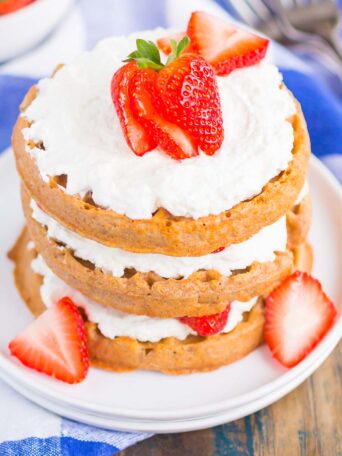 Strawberry Shortcake Waffles make a deliciously sweet and easy breakfast. Made with fresh strawberries, and whipped cream sweetened with honey, this dish is the perfect way to start your day!