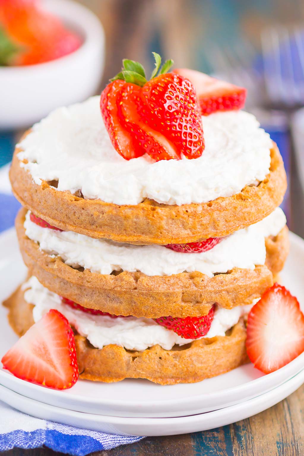 Strawberry Shortcake Waffles make a deliciously sweet and easy breakfast. Made with fresh strawberries, and whipped cream sweetened with honey, this dish is the perfect way to start your day!