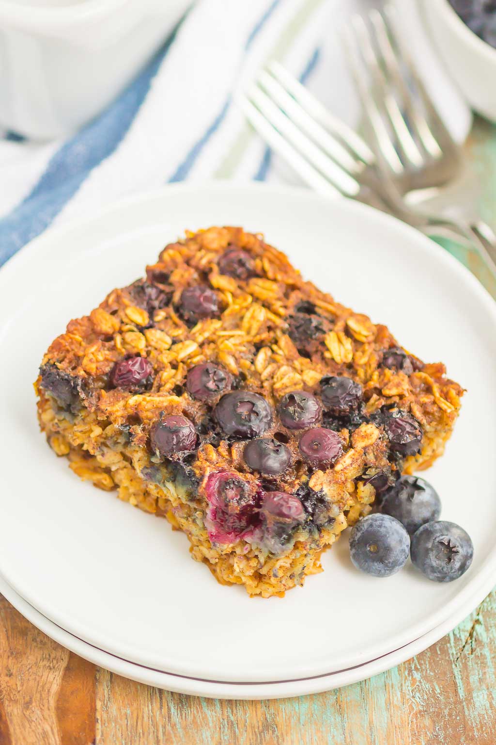 Blueberry Baked Oatmeal is an easy, make-ahead dish that's perfect for busy mornings. Tangy blueberries and hearty oats are sweetened with just the right amount of cozy spices. Serve this baked oatmeal with a drizzle of honey or maple syrup for a hearty breakfast!