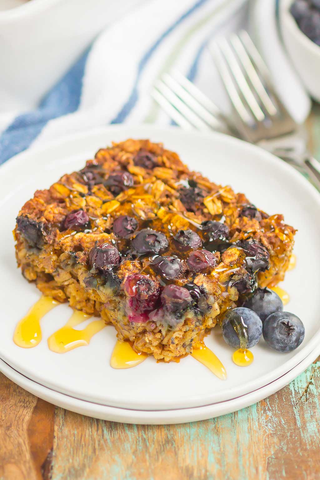 Blueberry Baked Oatmeal is an easy, make-ahead dish that's perfect for busy mornings. Tangy blueberries and hearty oats are sweetened with just the right amount of cozy spices. Serve this baked oatmeal with a drizzle of honey or maple syrup for a hearty breakfast!