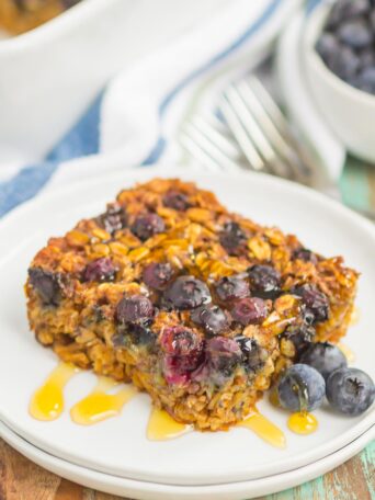 Blueberry Baked Oatmeal is an easy, make-ahead dish that's perfect for busy mornings. Tangy blueberries and hearty oats are sweetened with just the right amount of cozy spices. Serve this baked oatmeal with a drizzle of honey or maple syrup for a hearty breakfast!