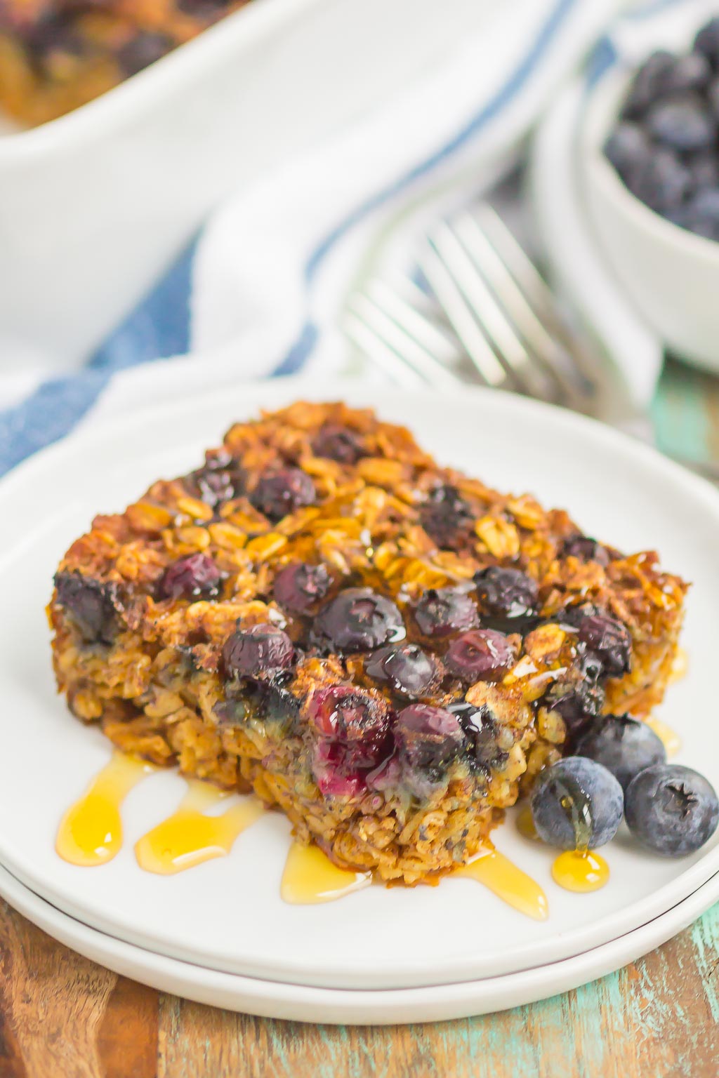 Blueberry Baked Oatmeal is an easy, make-ahead dish that's perfect for busy mornings. Tangy blueberries and hearty oats are sweetened with just the right amount of cozy spices. Serve this baked oatmeal with a drizzle of honey or maple syrup for a hearty breakfast!