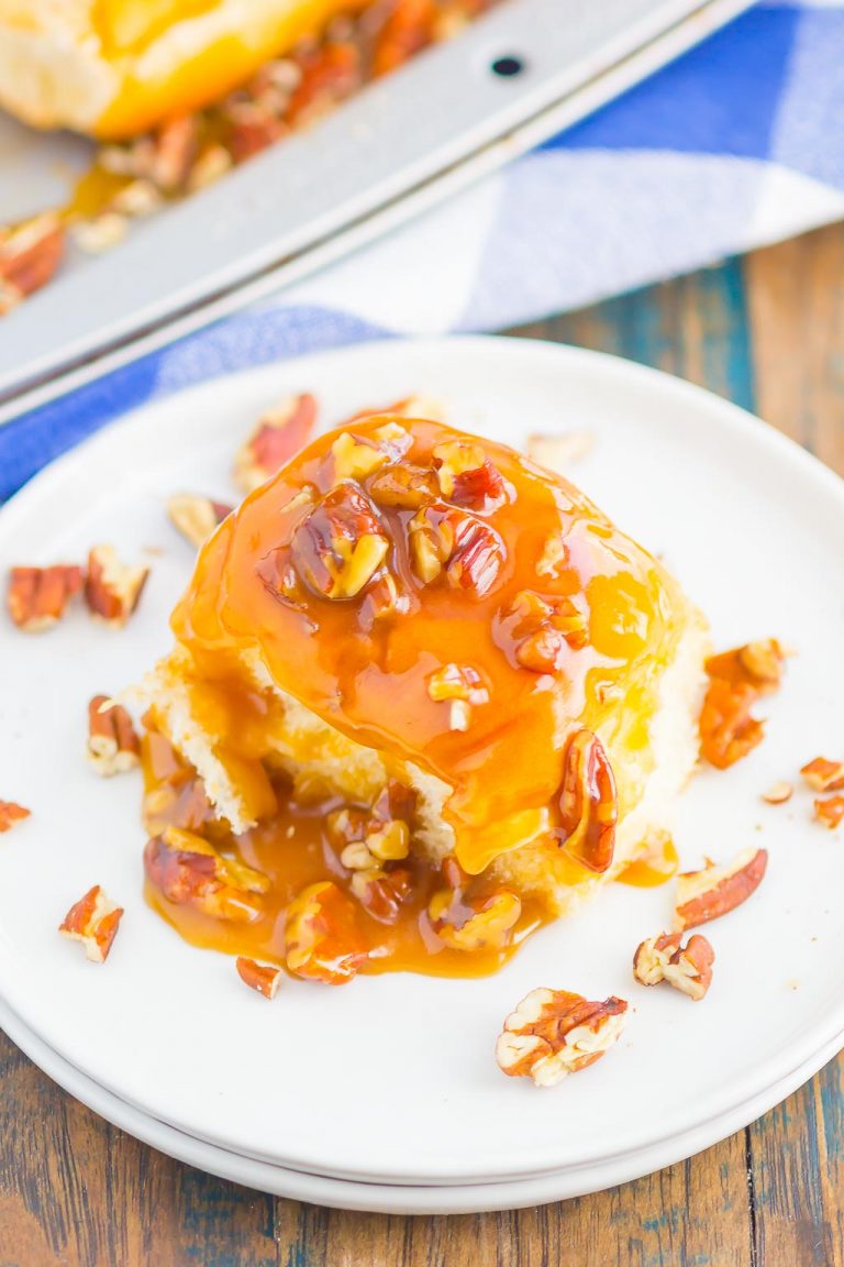 A Caramel Sticky Bun topped with a rich caramel sauce and chopped pecans.