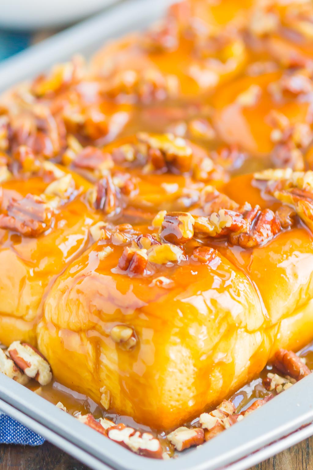 Caramel Sticky Buns are soft, sweet, and ready in just 30 minutes. Sweet rolls are topped with a rich caramel sauce, chopped pecans, and then baked until golden. Perfect for breakfast or dessert! #stickybuns #sweetrolls #caramelstickybuns #caramelrolls #breakfast #dessert