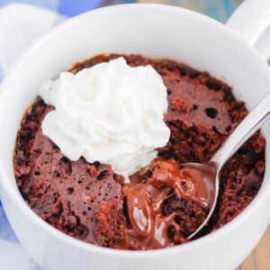 Chocolate Lava Mug Cake is moist and fudgy, with a warm molten center. Made in the microwave and ready in minutes, this easy treat is perfect for chocolate lovers! #mugcake #chocolatemugcake #chocolatelavamugcake #lavacake #lavamugcake #bestmugcake #dessert