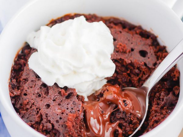Chocolate Lava Mug Cake is moist and fudgy, with a warm molten center. Made in the microwave and ready in minutes, this easy treat is perfect for chocolate lovers! #mugcake #chocolatemugcake #chocolatelavamugcake #lavacake #lavamugcake #bestmugcake #dessert