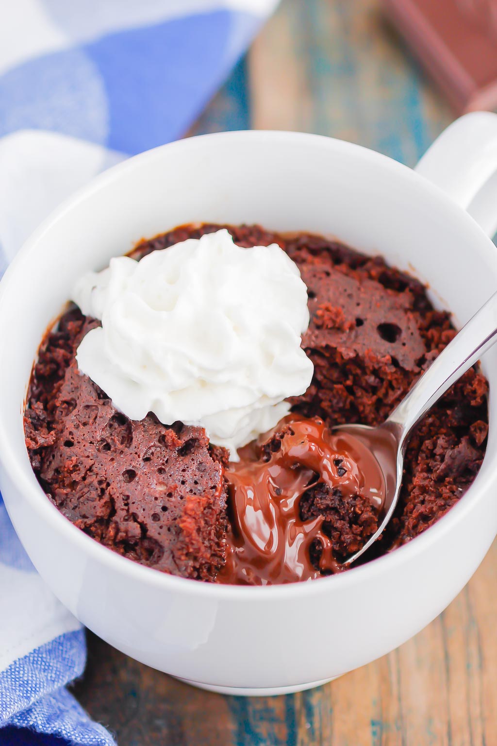 Chocolate Lava Mug Cake is moist and fudgy, with a warm molten center. Made in the microwave and ready in minutes, this easy treat is perfect for chocolate lovers! #mugcake #chocolatemugcake #chocolatelavamugcake #lavacake #lavamugcake #bestmugcake #dessert