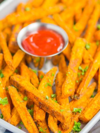 Crispy Baked Sweet Potato Fries are easy to make and seasoned to perfection. Healthier than the fried version and so delicious, these crunchy fries are perfect for a simple snack or side dish!