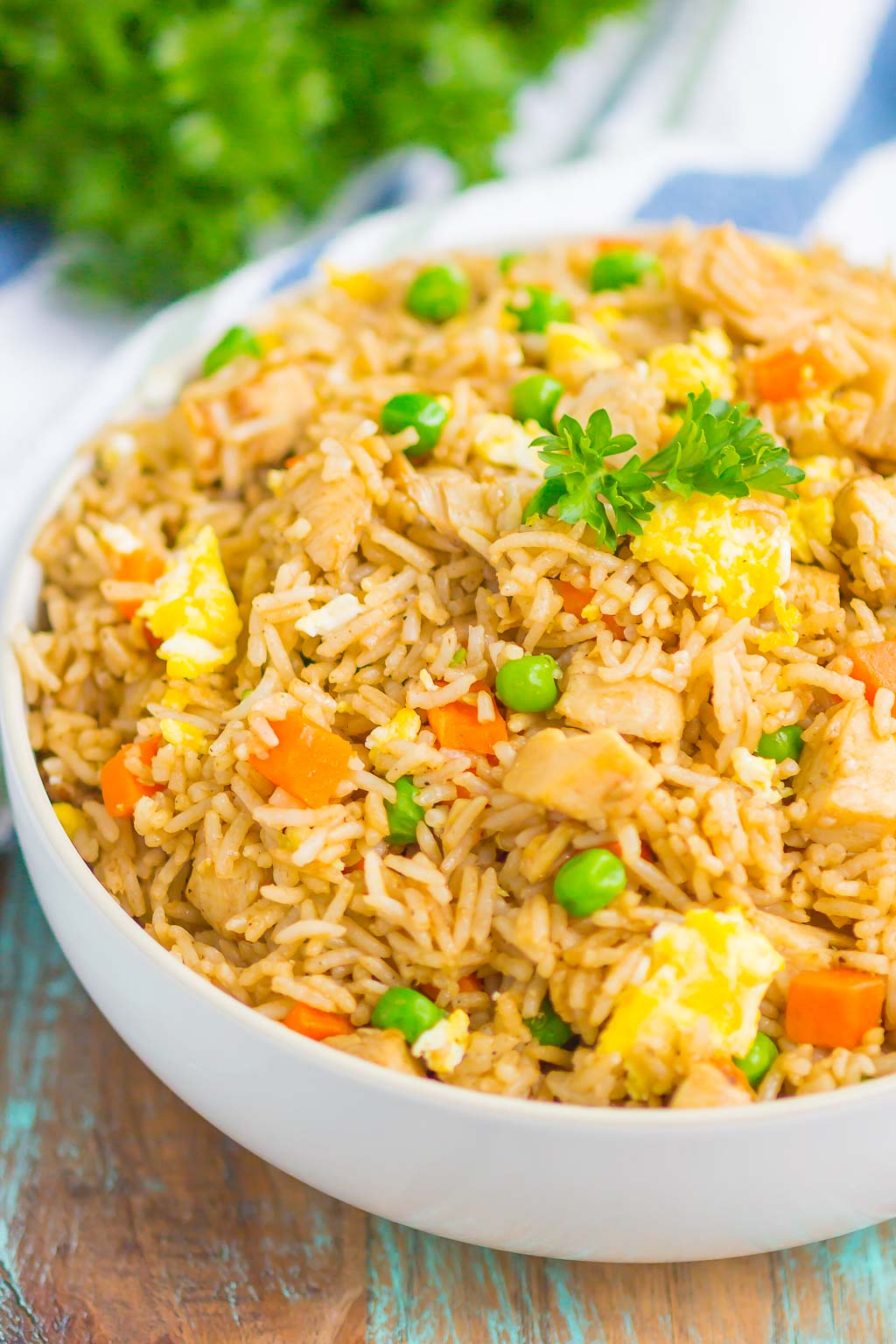 large white serving bowl filled with instant pot chicken fried rice