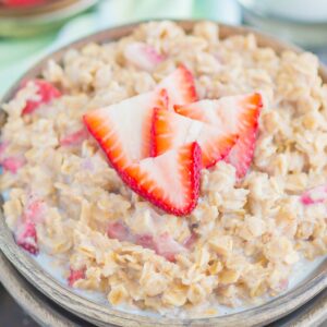 Strawberries and Cream Oatmeal is a deliciously simple way to start your day. With just a few ingredients and ready in minutes, this sweet and creamy oatmeal will keep you going all morning long! #oatmeal #strawberryoatmeal #strawberriesandcreamoatmeal #stovetopoatmeal #oatmealrecipes #breakfast #breakfastrecipes