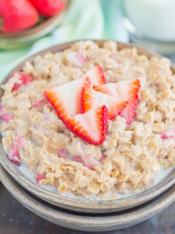 Strawberries and Cream Oatmeal is a deliciously simple way to start your day. With just a few ingredients and ready in minutes, this sweet and creamy oatmeal will keep you going all morning long! #oatmeal #strawberryoatmeal #strawberriesandcreamoatmeal #stovetopoatmeal #oatmealrecipes #breakfast #breakfastrecipes