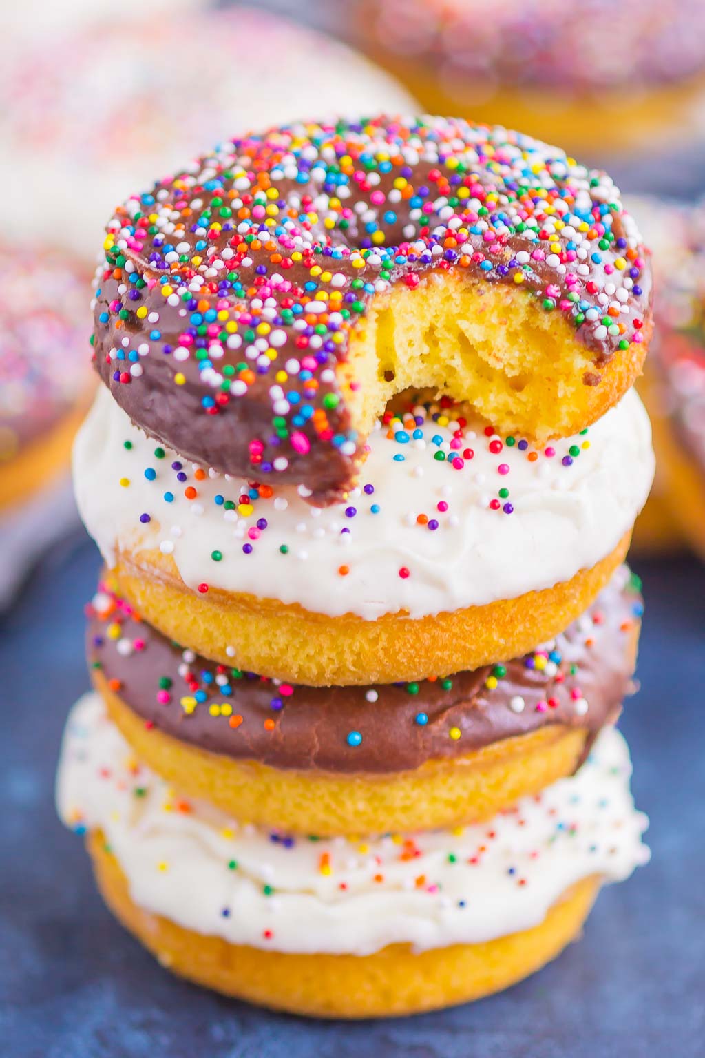 A stack of frosted cake mix donuts. 