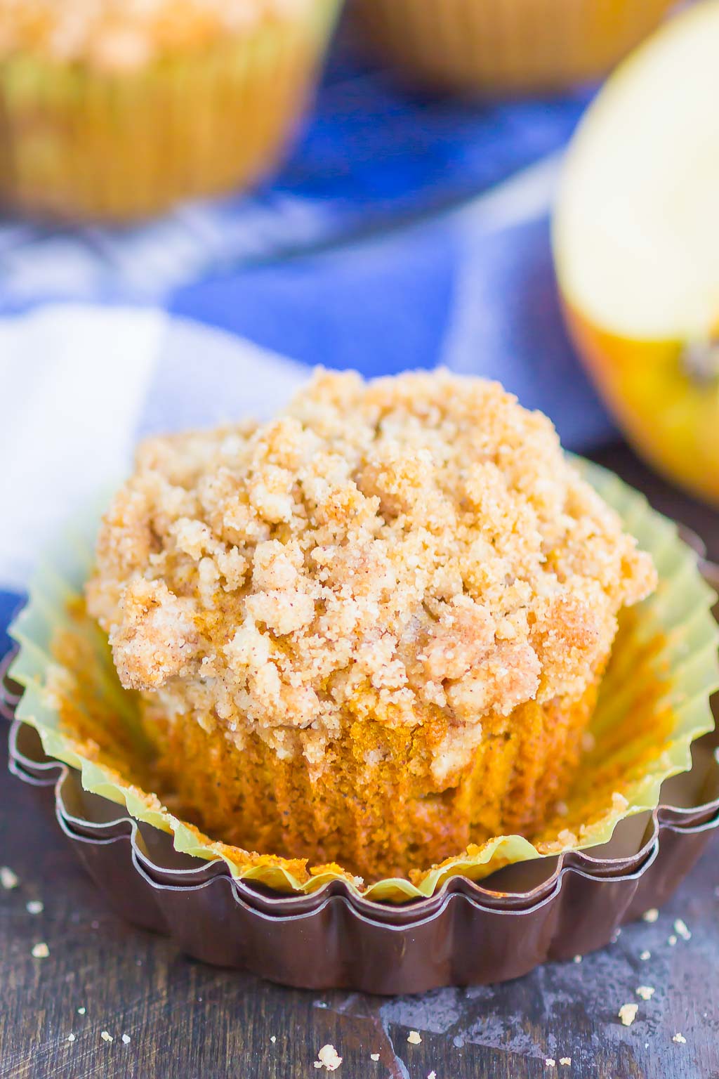 Pumpkin Apple Muffin in a muffin liner that's been pulled down. 