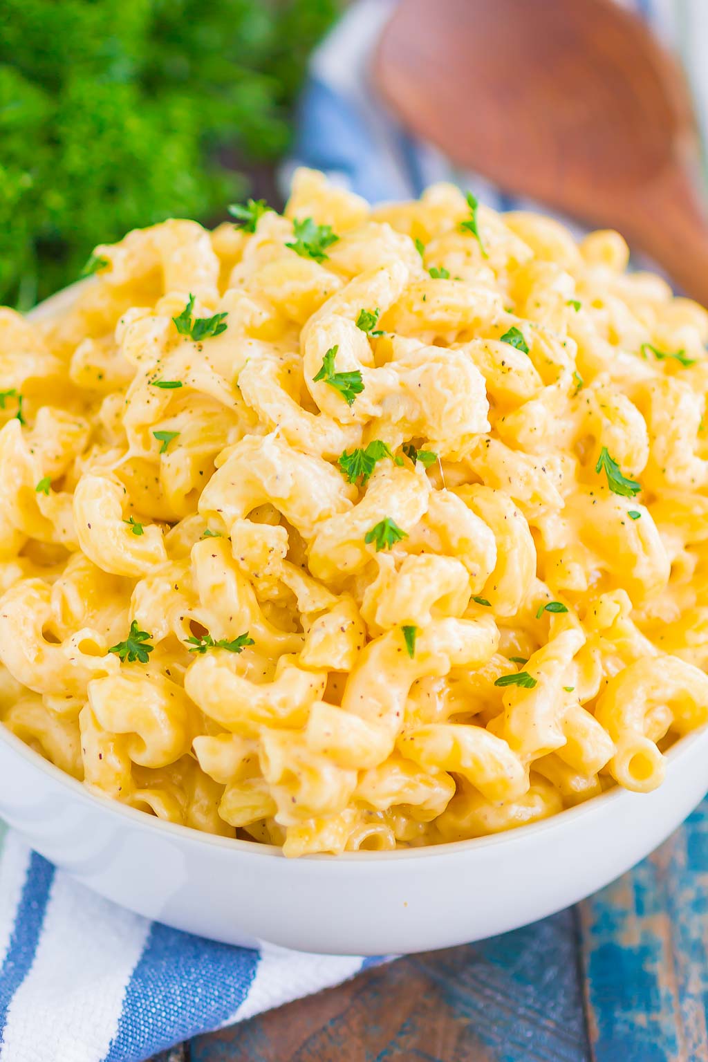 A large white bowl of creamy stovetop mac and cheese. 