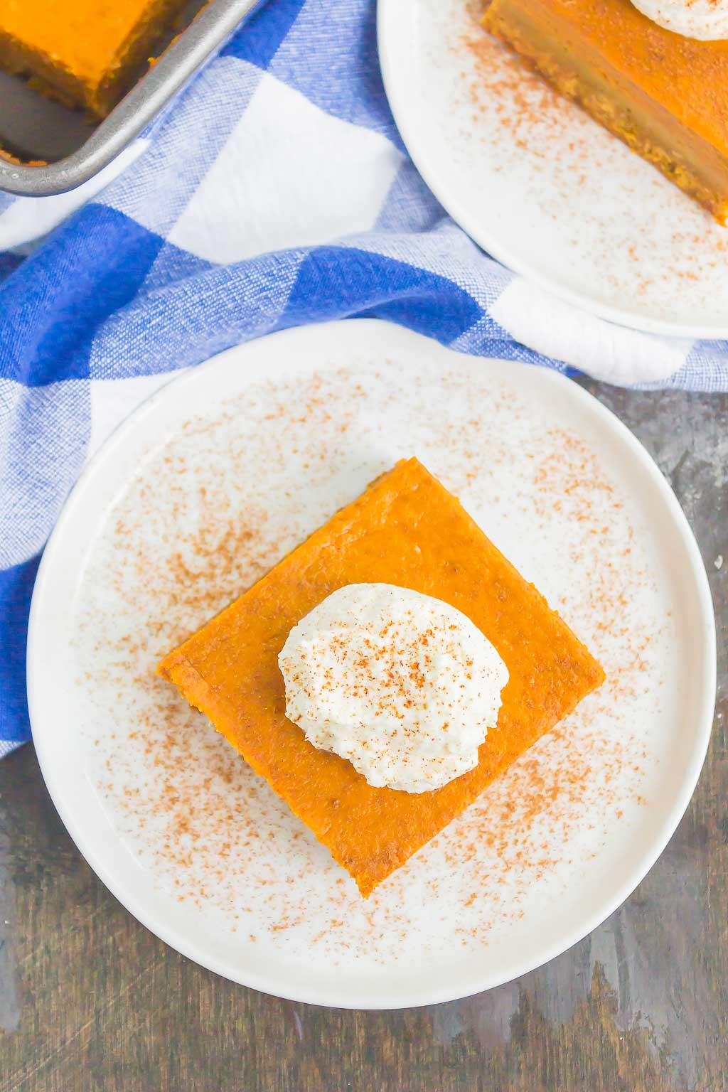 Overhead view of a pumpkin pie bar on a plate. 