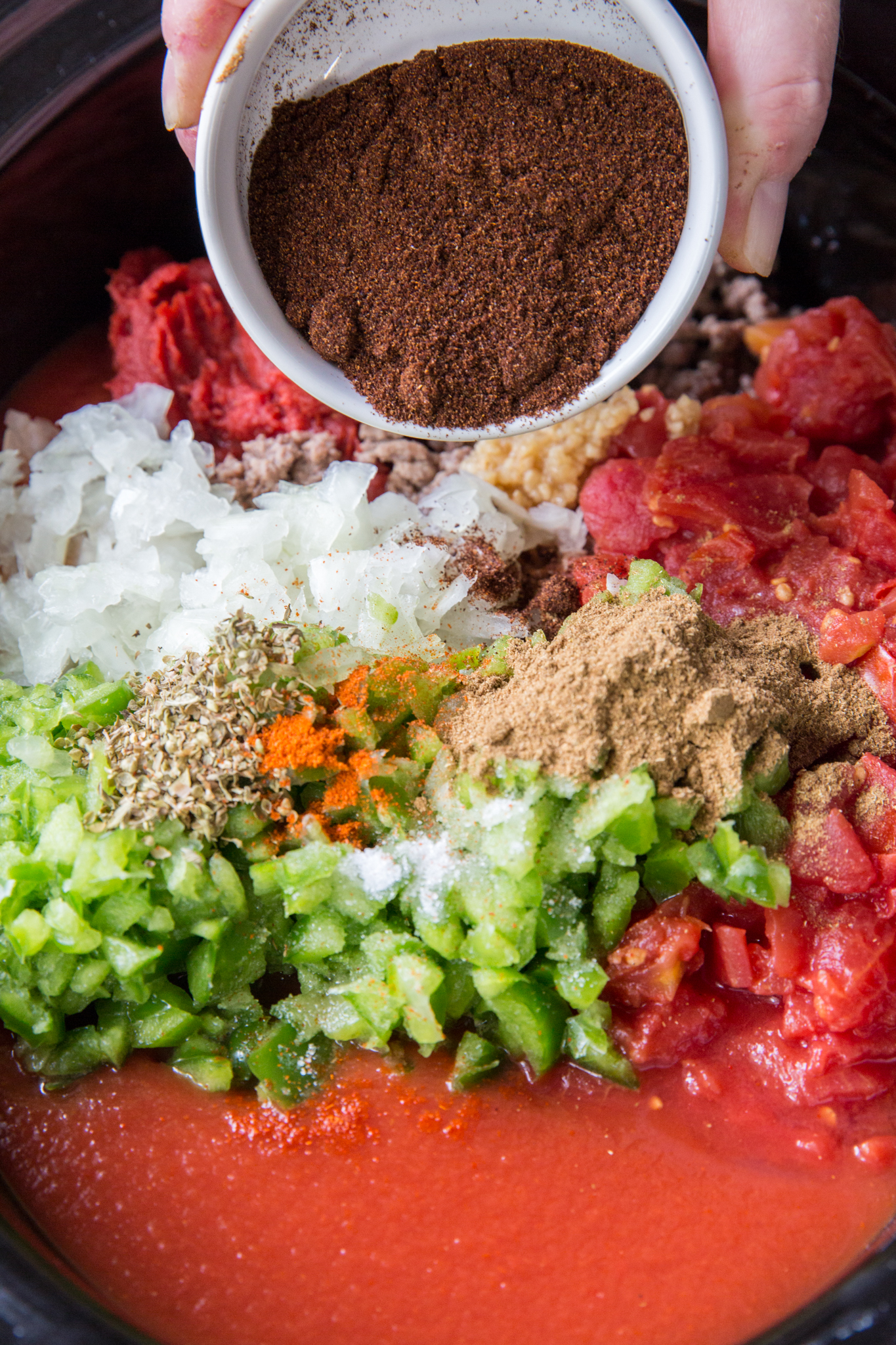 Ingredients needed to make chili without beans in a slow cooker.